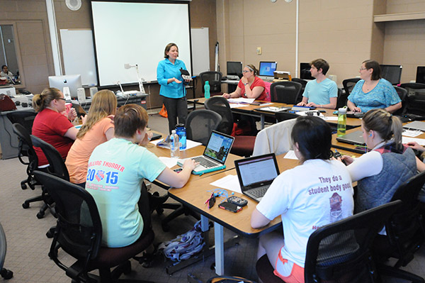 Photo of a group of high school students learning about assistive technologies